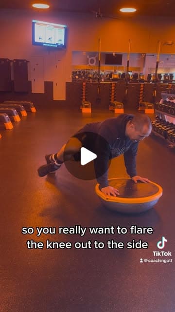 High plank alternating knee drive wide on the Bosu ball