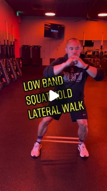Low band squat hold lateral walk