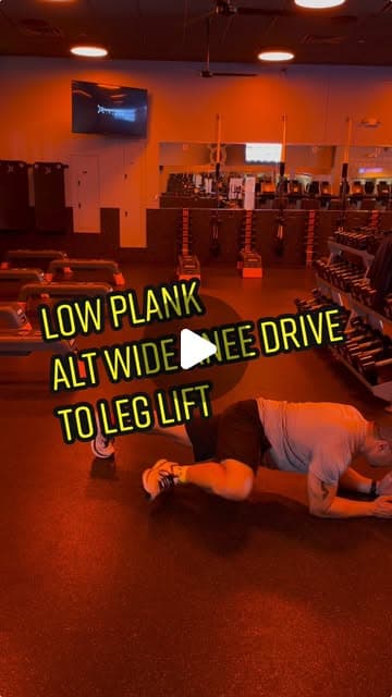 Low plank alternating wide knee drive to leg lift