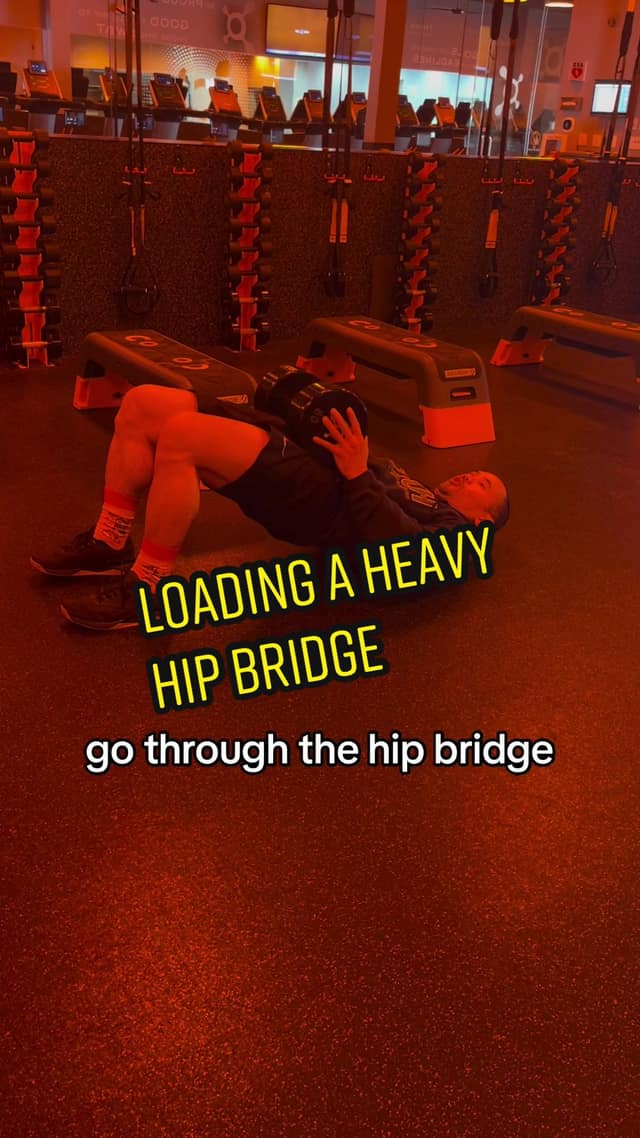 Loading a heavy dumbbell hip bridge TikTok preview